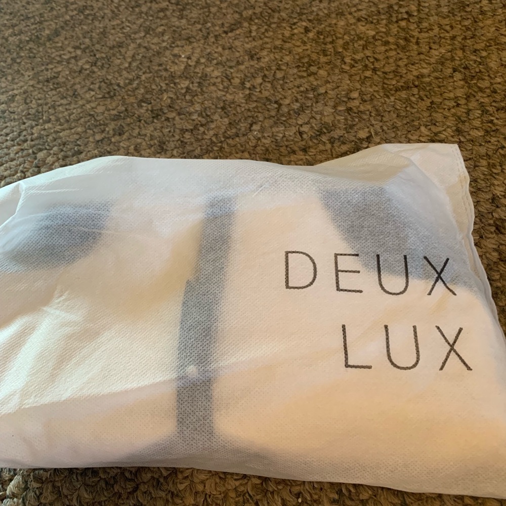Backpack. Brand new. Still in dust cover bag.